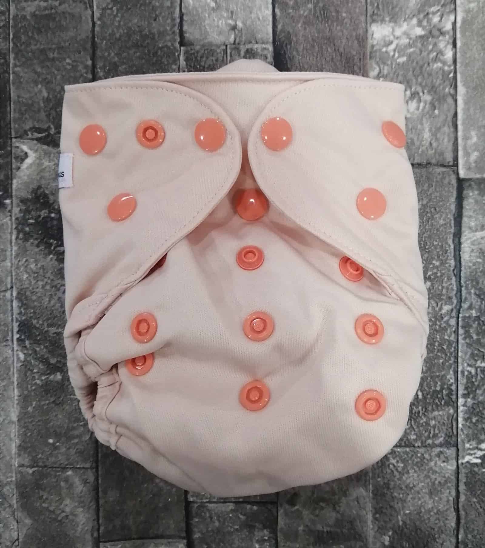 dav Pink cloth diaper with orange snaps, eco-friendly baby nappy, reusable diaper for babies.